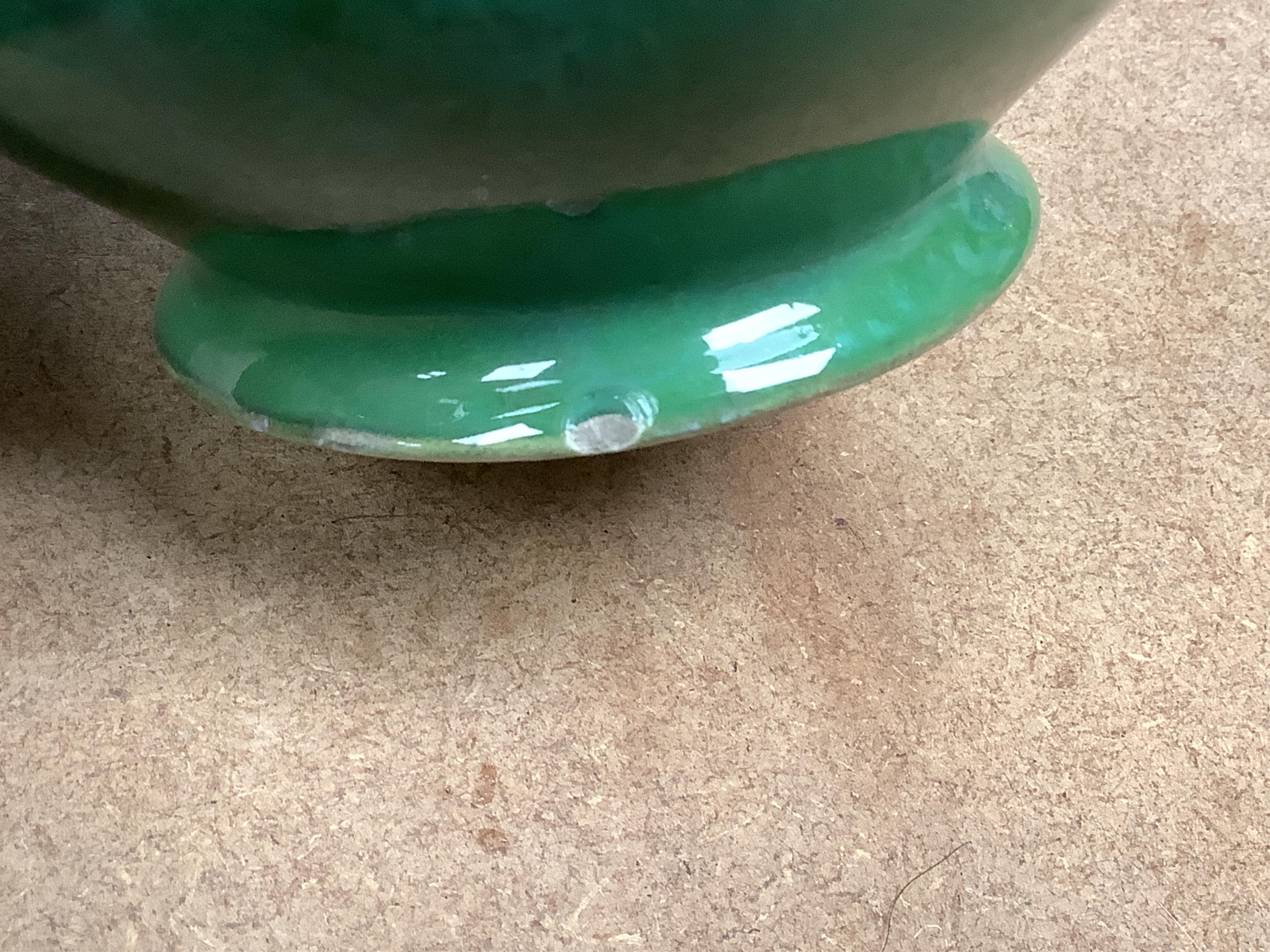 A Moorcroft for Liberty & Co. Flamminion Ware vase, and a smaller Moorcroft vase glazed in a mottled plum flambe, the first 20cm., also to include two Moorcroft reference books